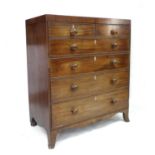 A Regency mahogany chest of two over four graduating drawers, in two halves for transport, with