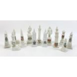 A collection of crested china monuments and clock towers, including a Devonia Art China monument