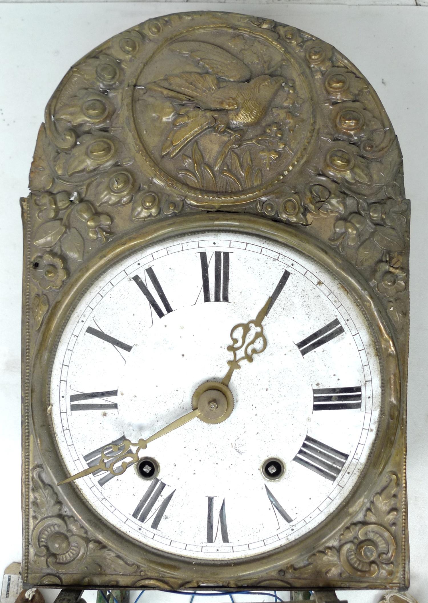 A French 19th century comtoise clock, the white enamel dial with black Roman numerals, in a