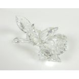 A Swarovski Crystal sculpture, modelled as a single stemmed rose, the leaves with droplets of water,