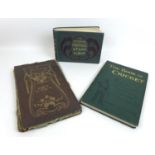 A collection of books with stamp and cigarette card albums, comprising 'The Book of Cricket'