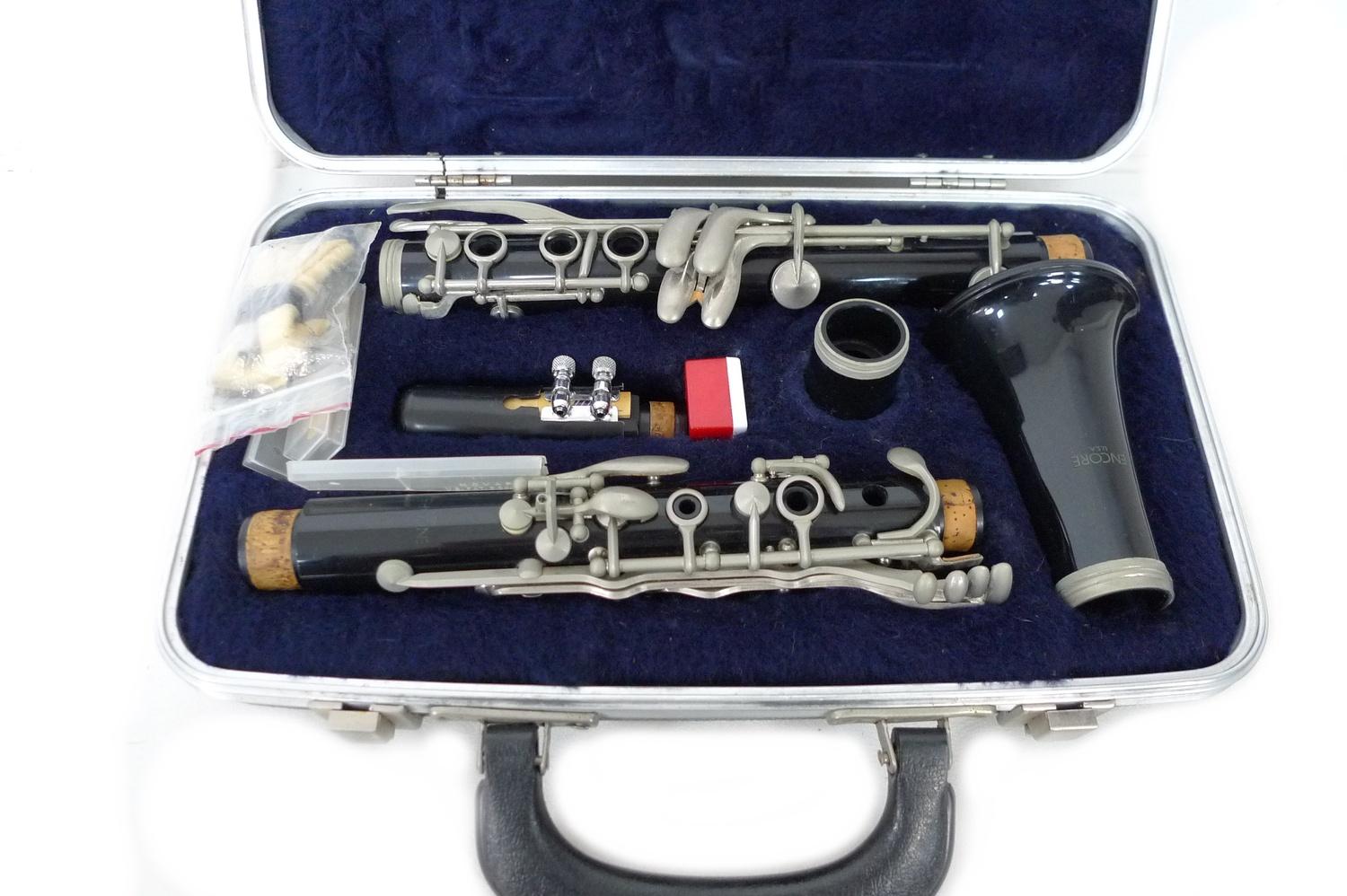 A cased USA made Encore clarinet with accessories and four marching flutes, including one by Rose- - Image 2 of 3