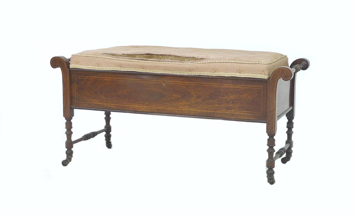 An Edwardian mahogany and line inlaid duet piano stool, scroll ends with turned bar handles,