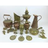 A group of copper and brass items, including an electric oil lamp, a crocodile skin embossed