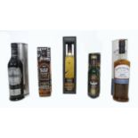 A group of five bottles of whisky, comprising a bottle of Glenfiddich Special Reserve, a bottle of