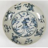 A South East Asian porcelain dish, possibly Korean, decorated in blue and white to a central roundel