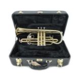 A brass Fortissimo Cornet, possibly the Volante model, with fitted hard case.