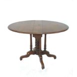 A Victorian walnut drop leaf table, the circular surface with moulded edge, raised on central and