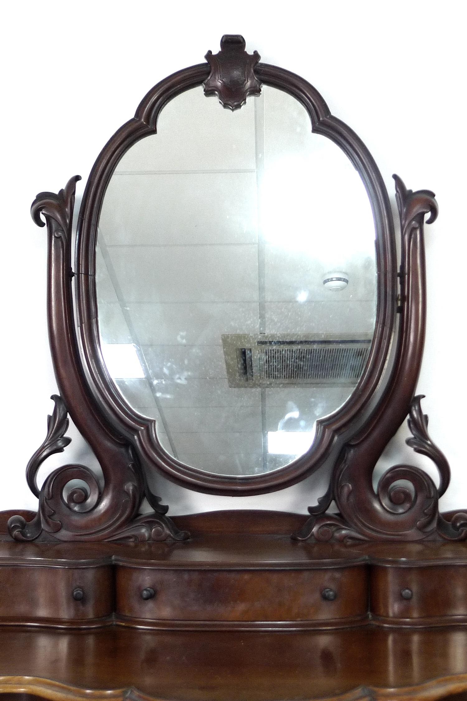 A Victorian mahogany dressing table, with oval mirror on shaped supports, three trinket drawers, the - Image 2 of 2