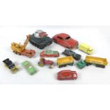 A collection of eleven playworn vintage model vehicles, comprising a Dinky Massey harris tractor,