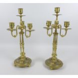 A pair of mid 20th century gilt metal four branch candelabra, inlaid with malachite cabochons,
