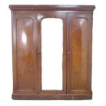 A late Victorian mahogany wardrobe, of three sections, with central full length mirror door,