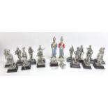 A collection of white metal soldier figurines, including different regiments and periods of uniform,