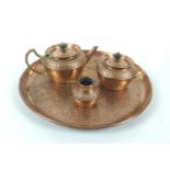A Victorian four piece planished copper tea set