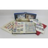 A collection of stamps and first day covers, including some mint and unused British stamps, a WW2