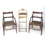 A pair of Edwardian mahogany open armchairs, in the style of Gillows, with line carved frames,