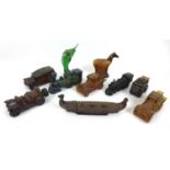 A collection of vintage 1970s novelty aftershave bottles, shaped as cars, trains, a viking boat, a