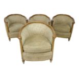 A set of four modern tub armchairs, in Art Deco style, with shaped stained wooden frames, cream