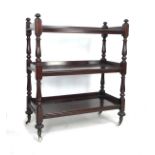 A William IV / early Victorian mahogany three tier buffet server, with turned supports, raised