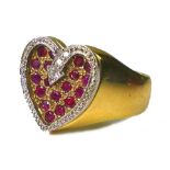 A 9ct gold, diamond and ruby valentine heart ring, formed of eighteen rubies within a recessed heart