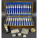 A group of silver and plated items including a silver trinket box, cigarette case, napkin ring and