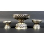 A group of three graduated Cambodian Khmer silver pedestal bowls, the largest decorated with