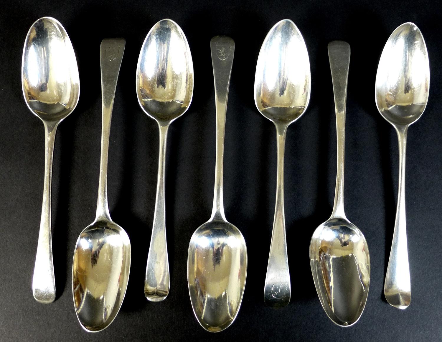 A collection of seven George III silver tablespoons, comprising two with transitional rat tail