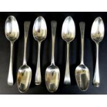 A collection of seven George III silver tablespoons, comprising two with transitional rat tail