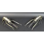 A pair of South East Asian white metal prawns, likely Cambodian Khmer silver, possibly by Sok Leng