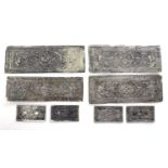 A group of Chinese or South East Asian white metal book binding covers, each of rectangular form