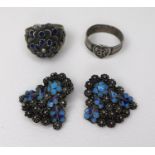 A pair of white metal ear-clips, likely Russian silver, with turquoise cloisonne detail amongst