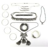 A collection of Cambodian, Burmese and South East Asian vintage white metal jewellery, comprising