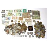 A collection of British and international coins and bank notes, including some with silver