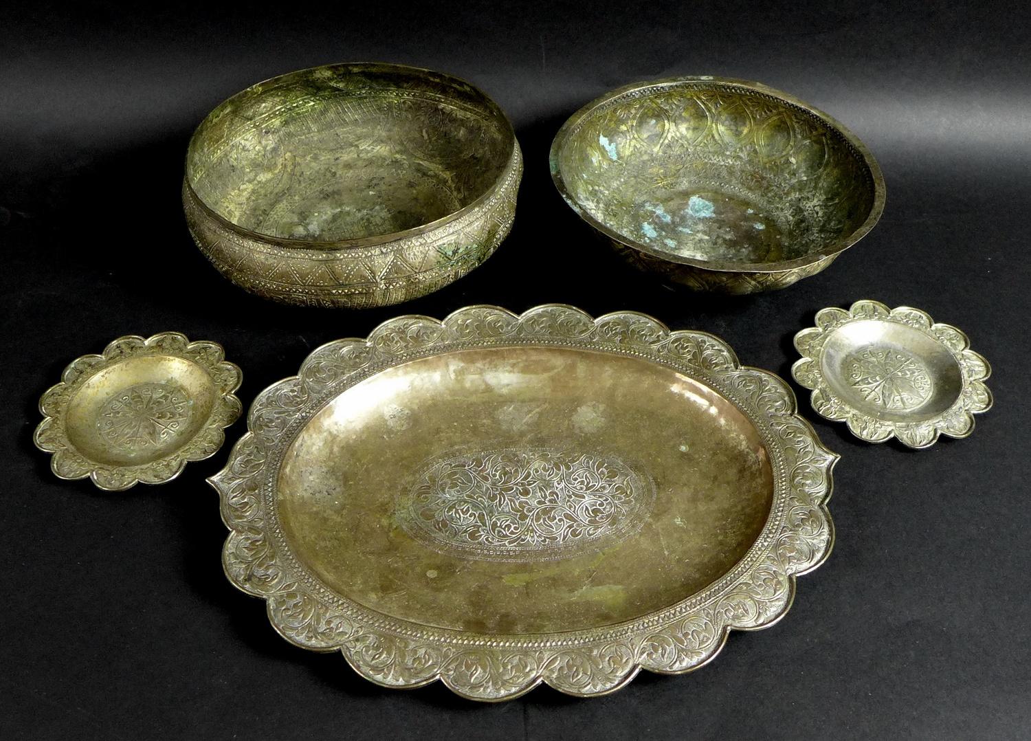 A group of South East Asian white metal items, comprising an oval tray, 33.5 by 25.5cm, a pair of