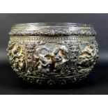 An early to mid 20th century Burmese silver bowl, intricately chased and repousse work with