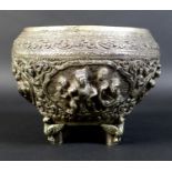 A 19th century Burmese silver Thabeik bowl, with four panels depicting mythical scenes in high