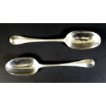 Two George I silver Hanoverian rat tail pattern tablespoons, comprising one by Phillip Roker II,