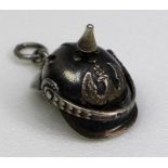 A silver novelty charm, early to mid 20th century, in the form of a WWI German Pickelhaube, finely