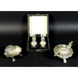 A group of three silver condiment holders, comprising a large Edward VII silver mustard, with hinged