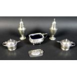 A group of five silver Victorian and Edwardian condiments, comprising a pair of Victorian urn shaped
