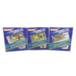 Three Scalextric SRS cars with boxes, comprising a Porsche 956 (C018) and two Peugeot 205 Turbo