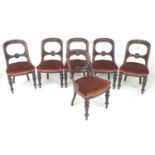 A set of six mid Victorian mahogany balloon back dining chairs, with blind carved decoration, red/