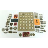 A group of over sixty British Army badges and buttons, including shoulder titles for the Royal