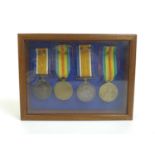 Two pairs of WWI medals with recipients possibly brothers, comprising a WWI War and Victory medal