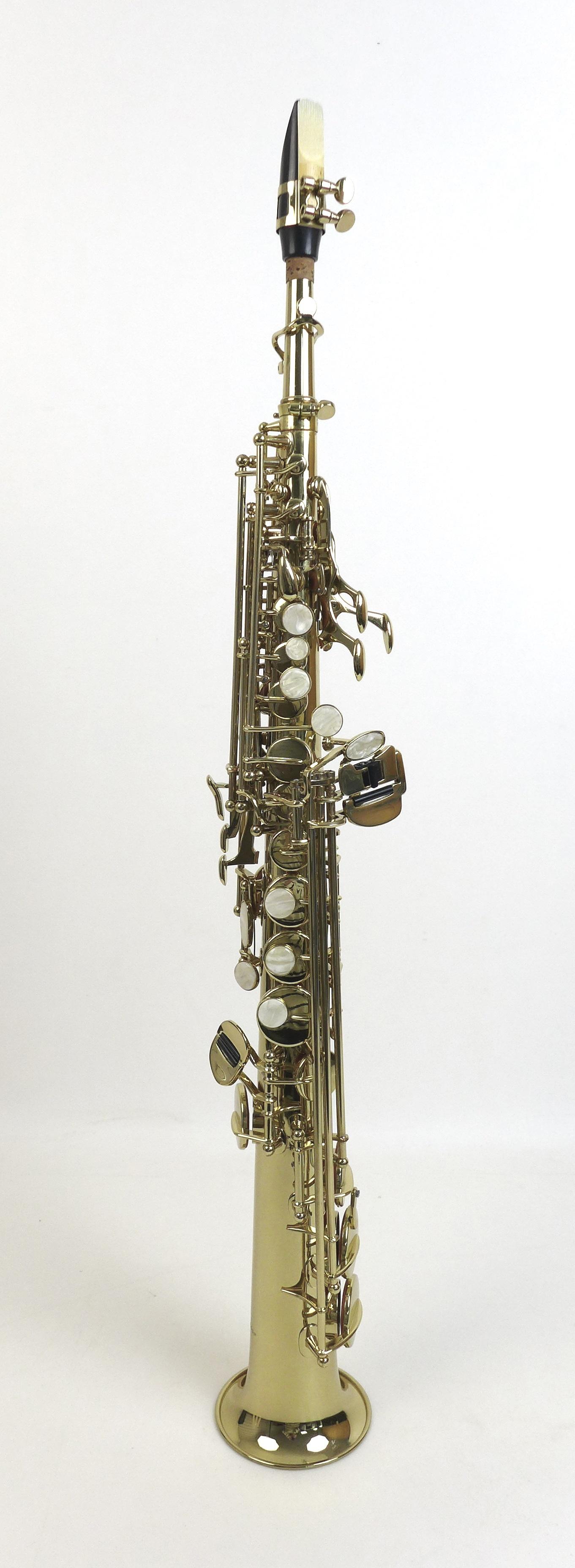 A Windsor soprano saxophone, with mouth piece and replacement reeds and a fitted hard case.