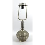 A white metal or brass silvered bottle vase, likely 19th century Indian the gourd form base