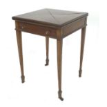 An Edwardian mahogany envelope card table, with a single drawer, raised upon tapered legs upon