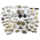 A group of fifty five British and Rhodesian army badges and buttons, replicas and originals,