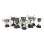 A group of eight 1930s British army silver plated sporting trophies, all with circular wooden or