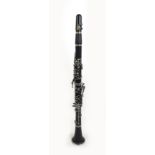 An Arnold & Sons five piece clarinet, 66.5cm long, with spare connecting section, with spare reeds